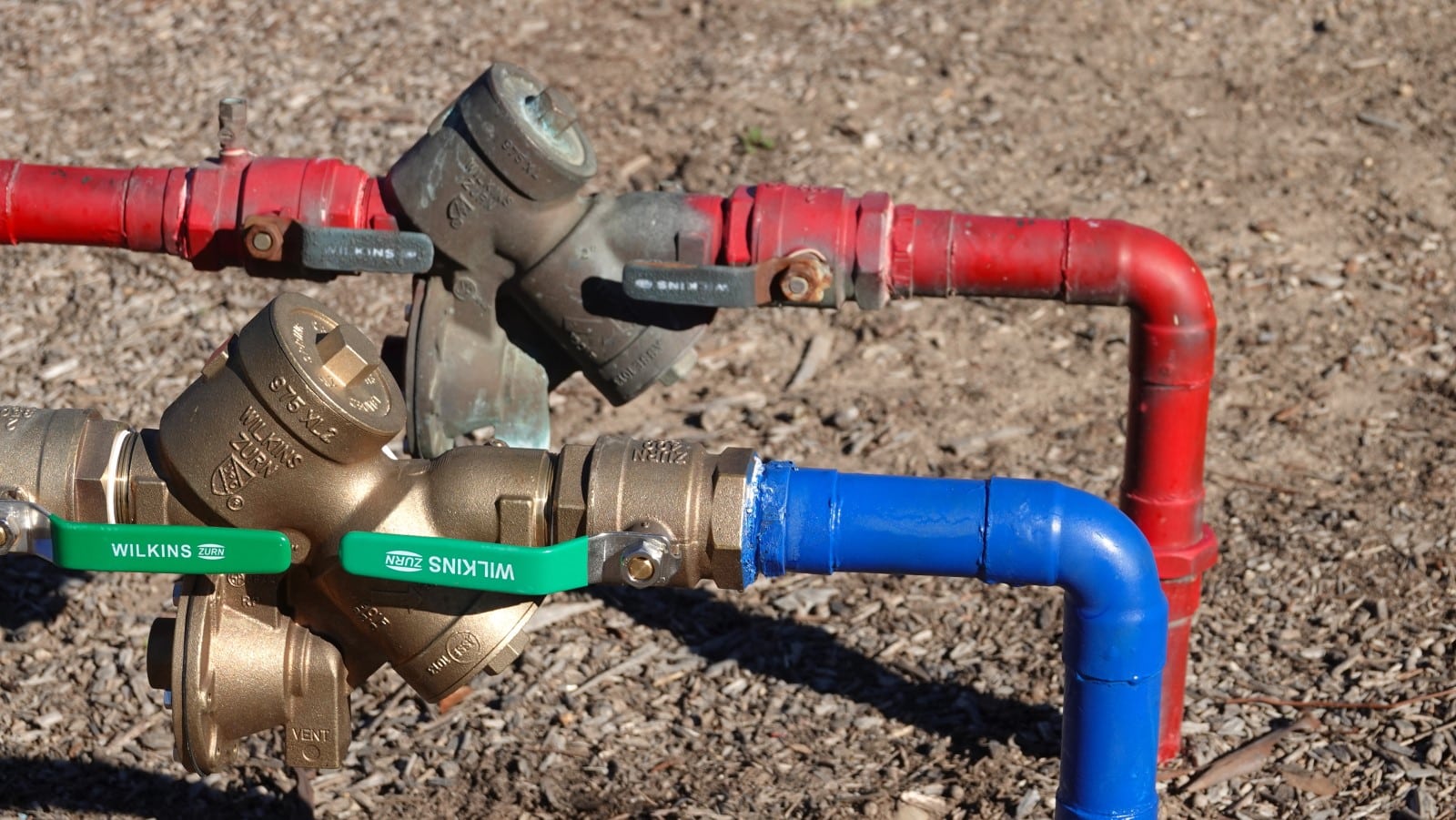 Two water lines both equipped with backflow preventers